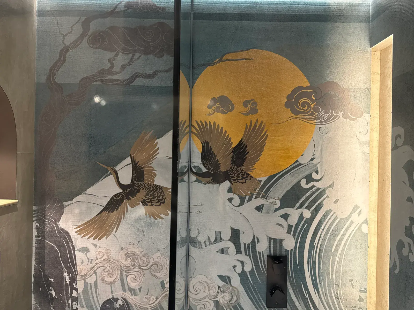 Hand-painted crane and wave panels on glass