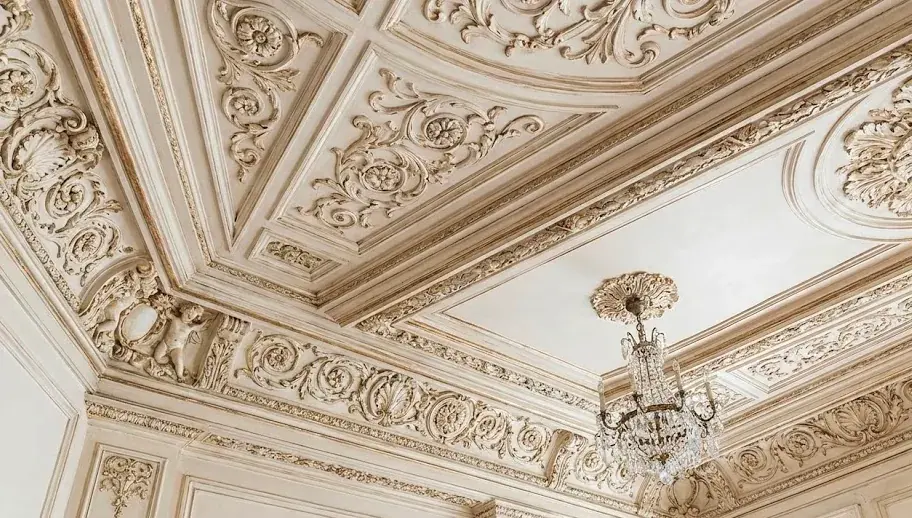 Ornate fibrous plaster ceiling with deep cornices, panel mouldings and a ceiling rose in Dubai