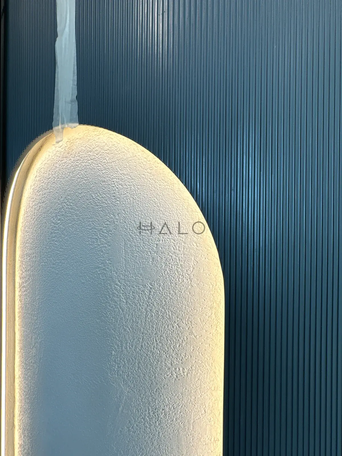 Fluted wall panel and feature light — Almas, Halo Interiors