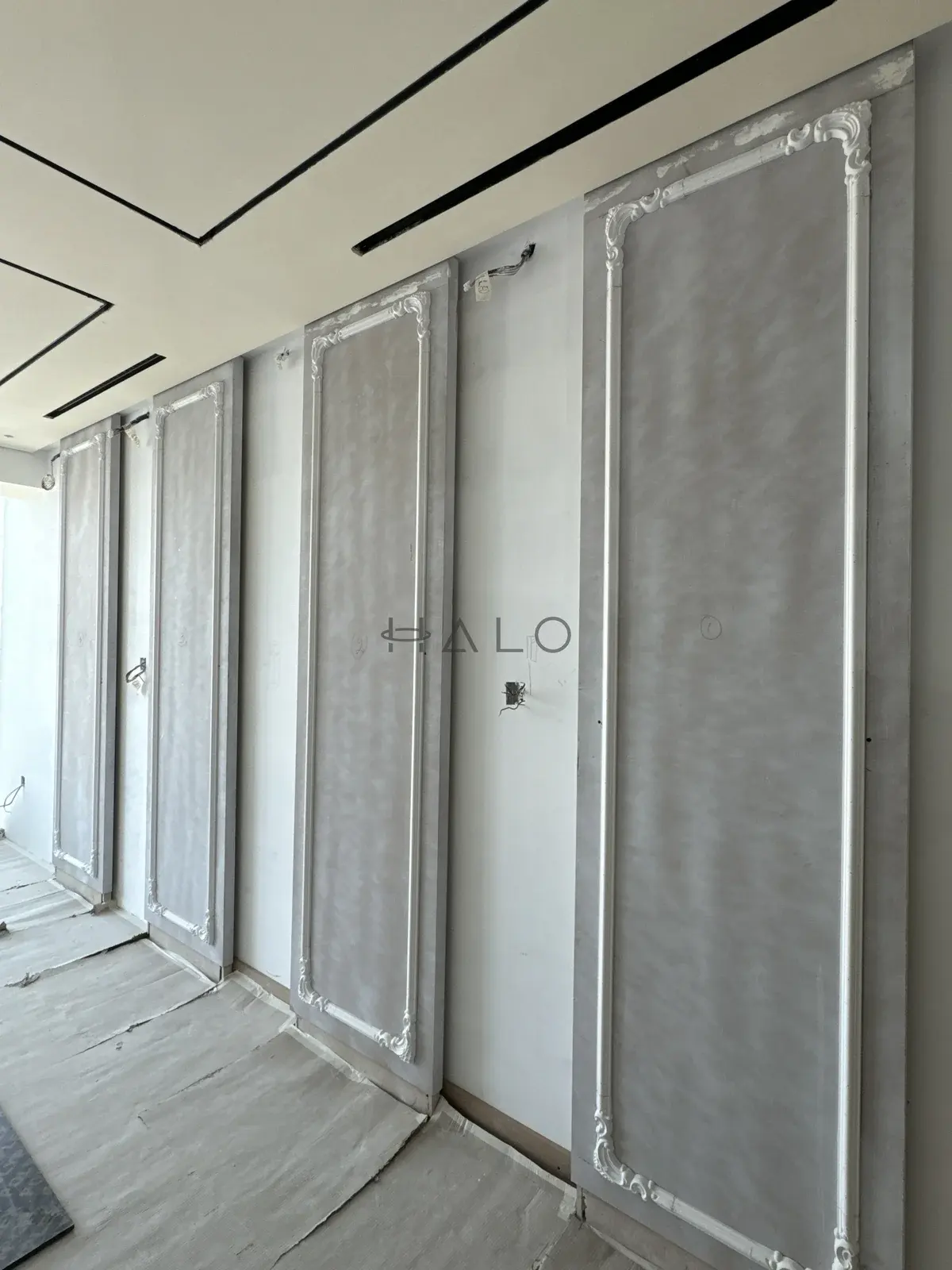 Decorative wall panelling in progress — Almas, Halo Interiors