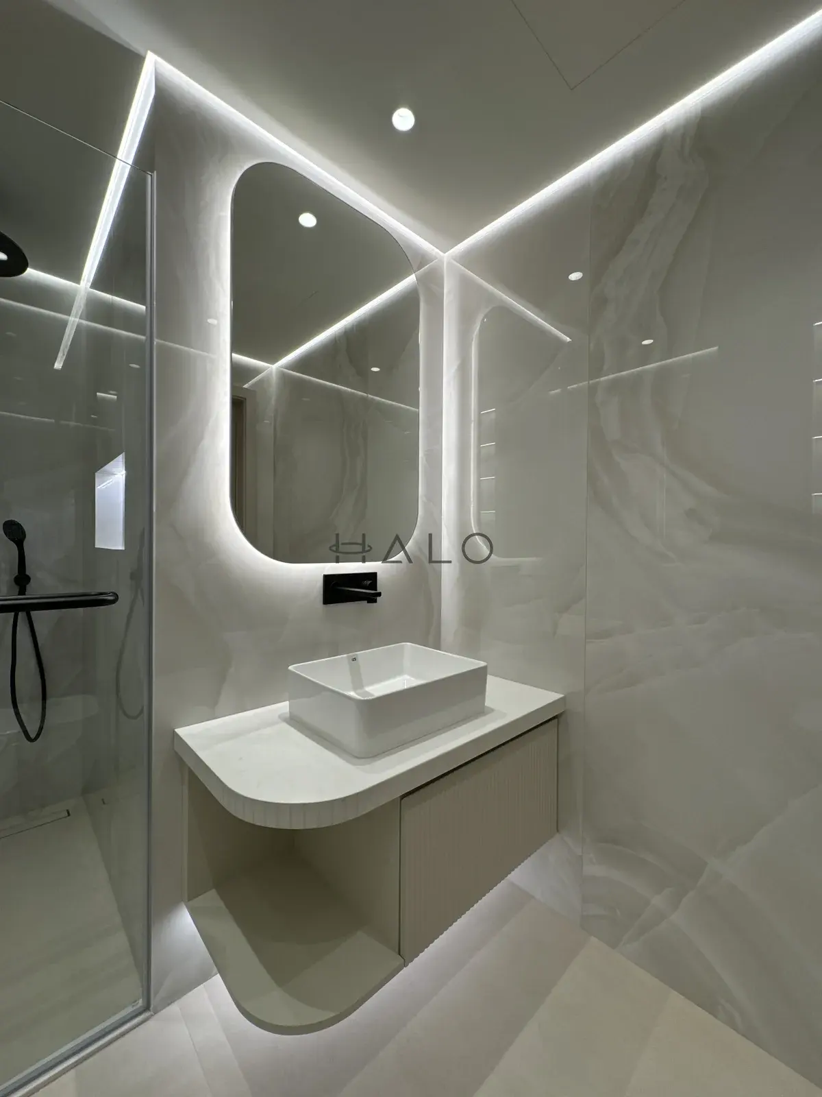Curved powder room vanity cabinet — Burj Vista, Halo Interiors