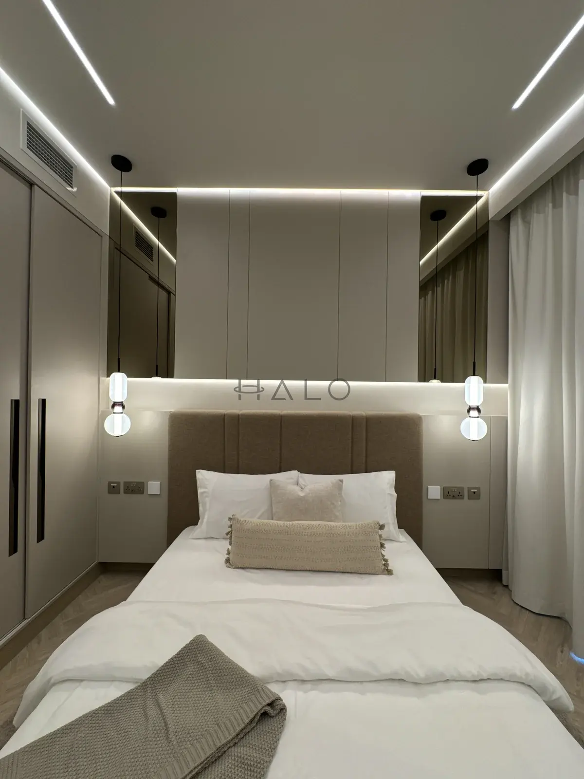 Bed and panelled headboard wall — Forte Tower, Halo Interiors