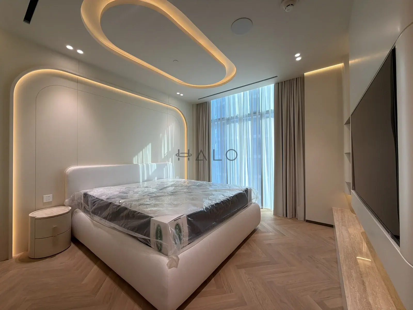 Bed and curved headboard wall — Downtown Dubai, Halo Interiors