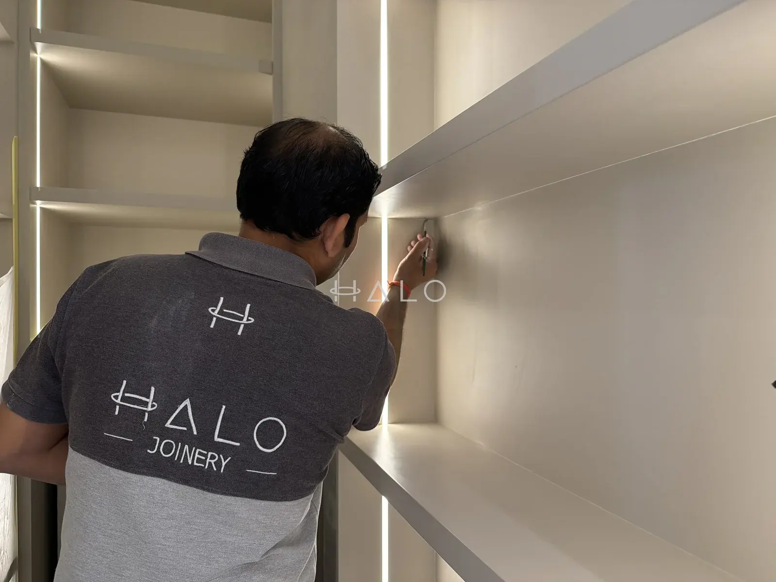 Wardrobe shelf installation detail — Downtown Dubai, Halo Interiors