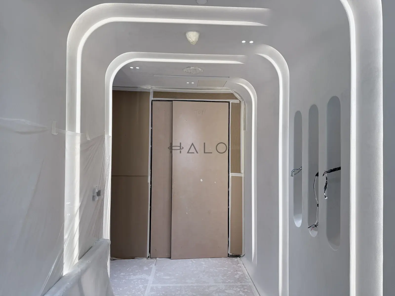 Curved corridor panelling in progress — Downtown Dubai, Halo Interiors