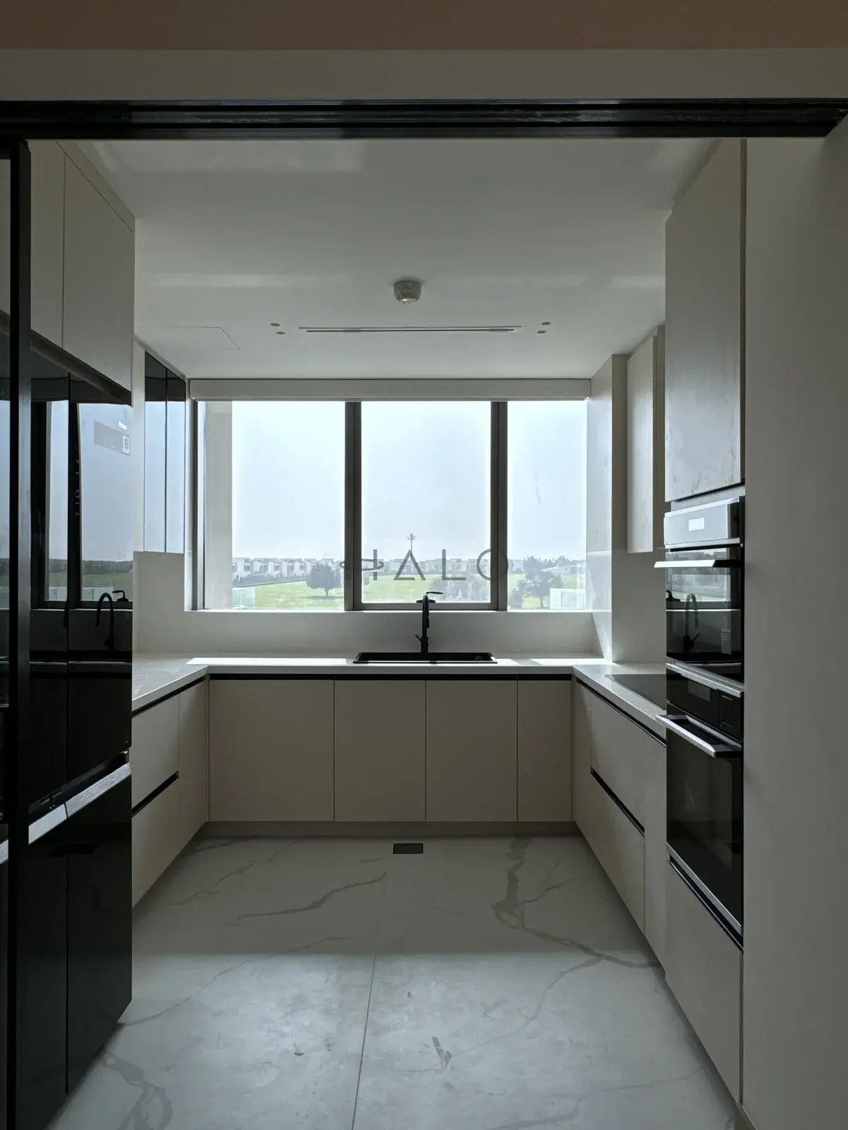 Kitchen cabinets wide view — Meydan, Halo Interiors