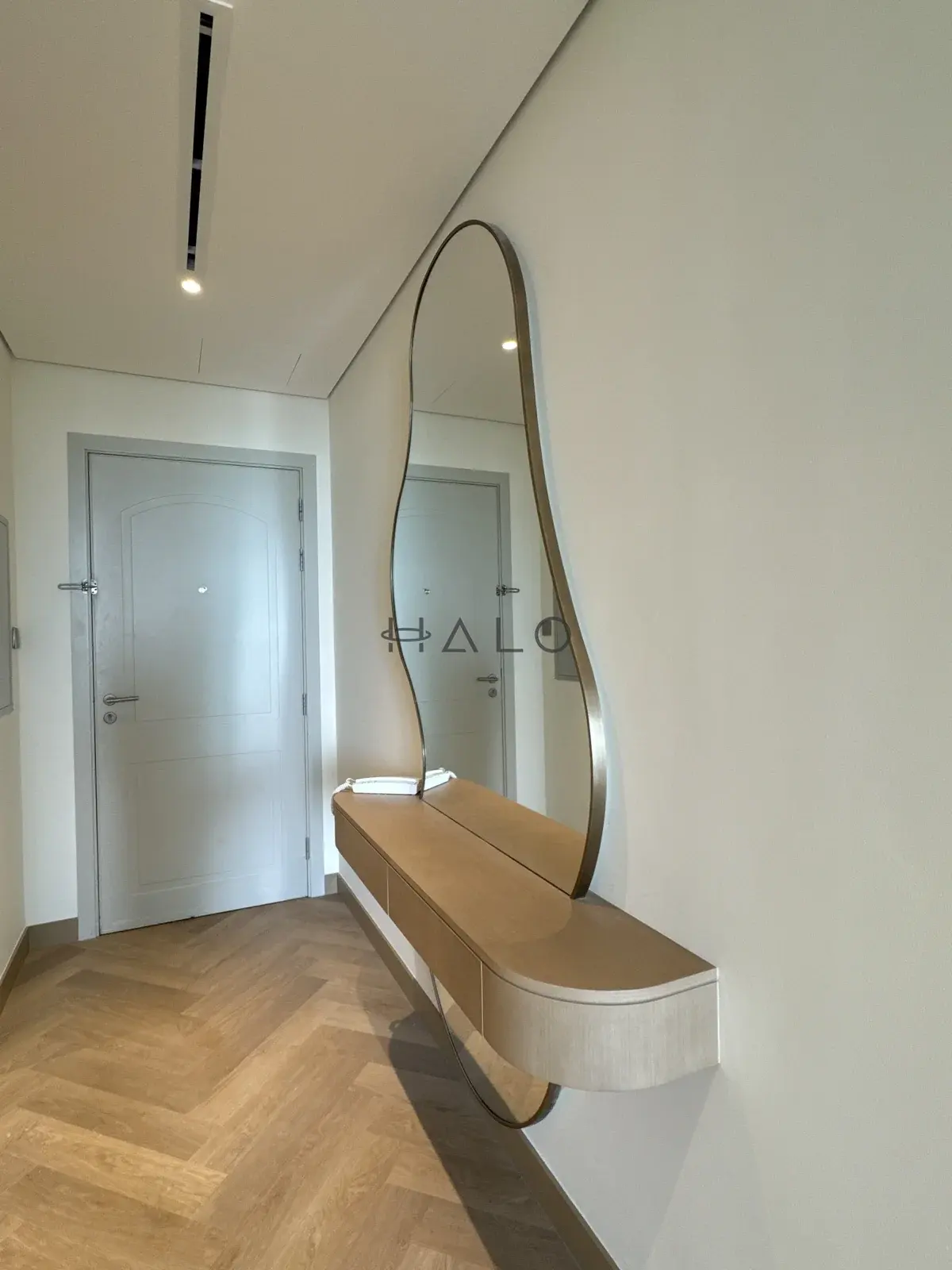 Entryway console and oval mirror — Meydan, Halo Interiors