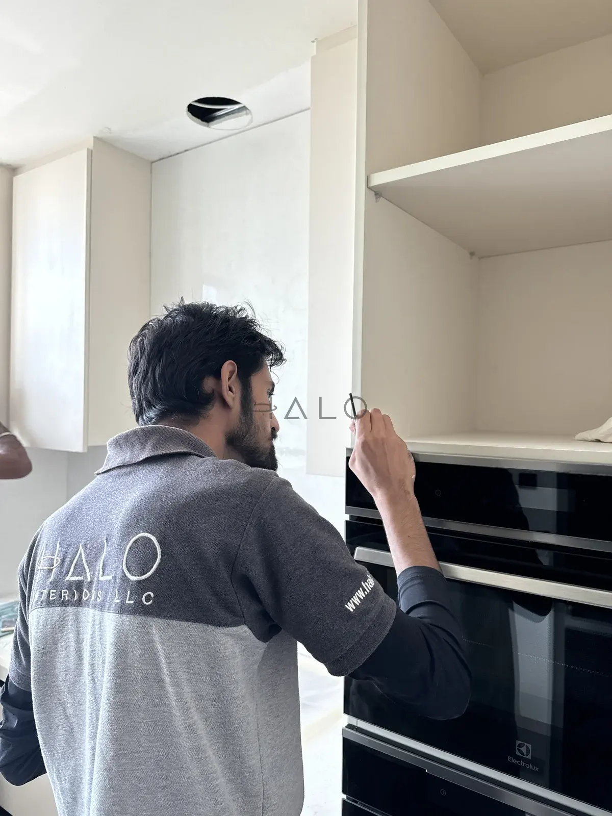 Kitchen cabinet installation detail — Meydan, Halo Interiors