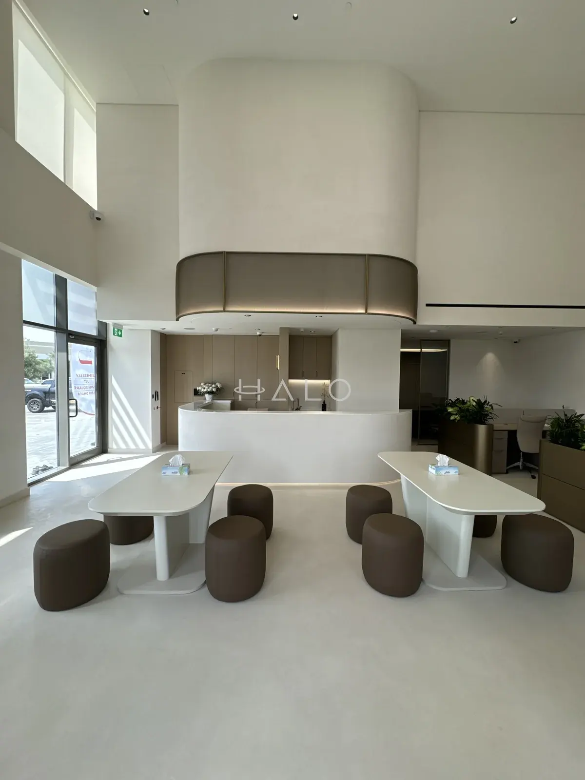 Communal tables and overhead cabinetry — USH / Nshama, Halo Interiors