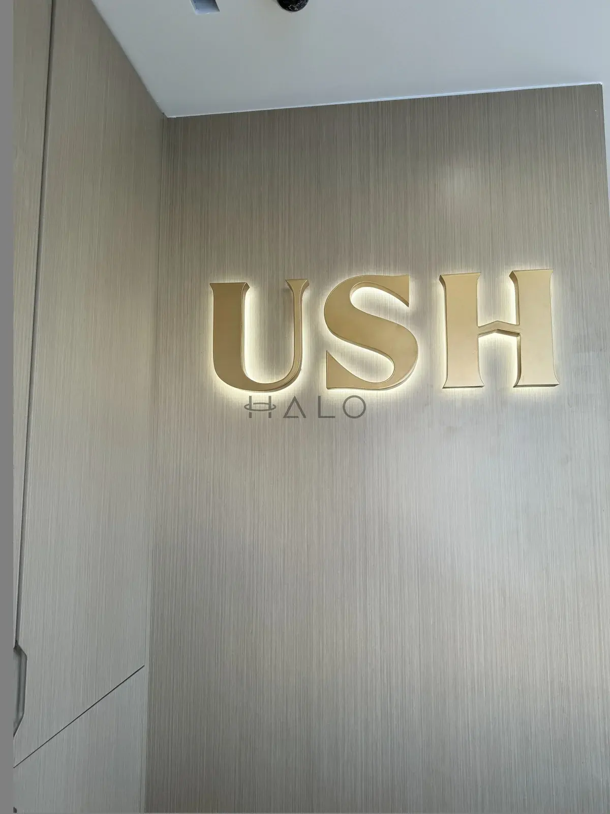 Branded feature wall panelling — USH / Nshama, Halo Interiors