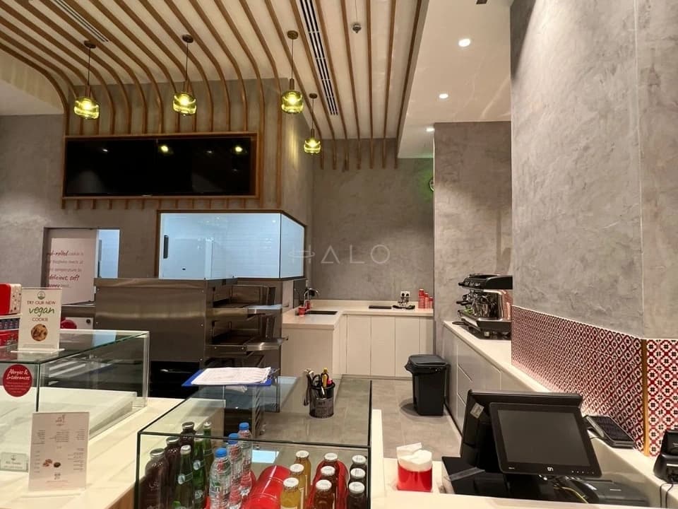Retail counter with bespoke joinery and integrated lighting — portfolio view 02
