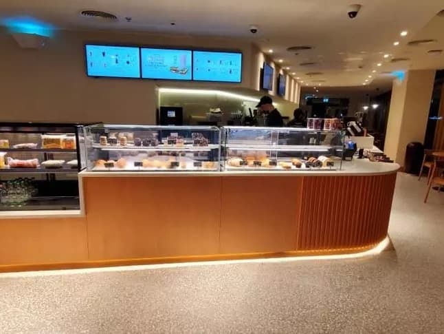 Store interior with wall bays, accent lighting and brand graphics — portfolio view 03