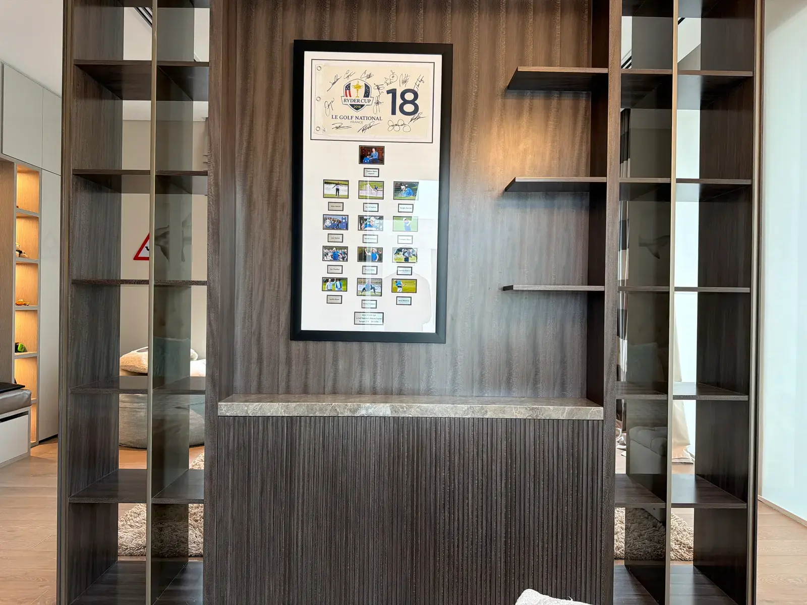Study with fluted timber joinery and lit display shelving