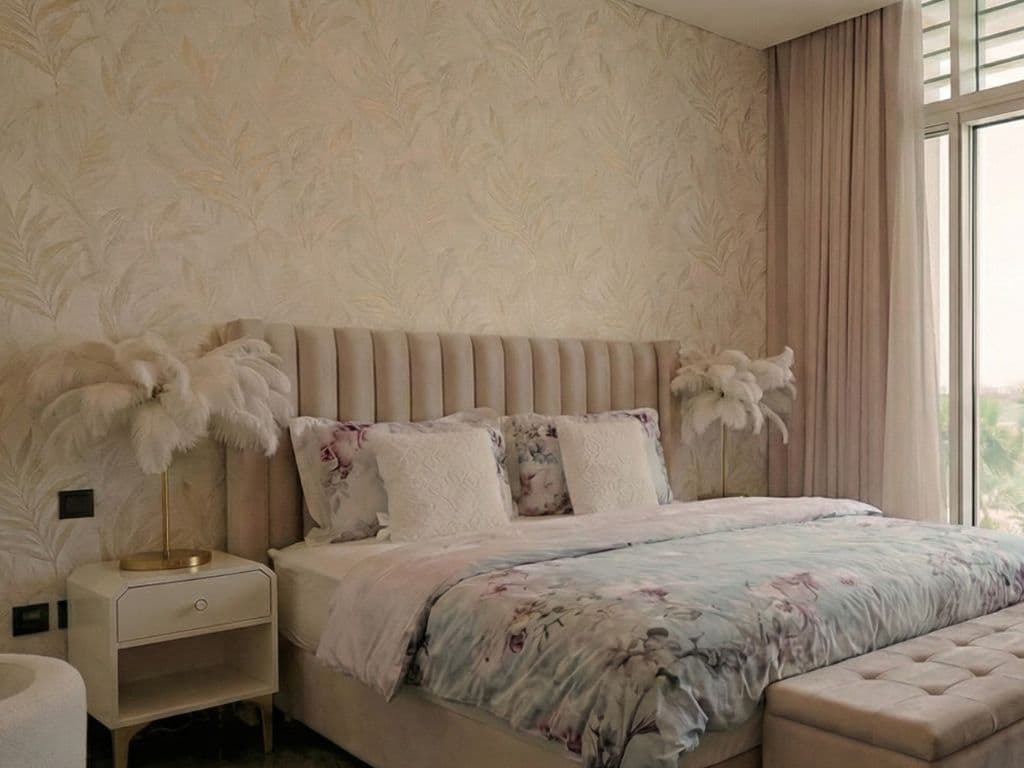 Upholstered headboard wall with integrated bedside joinery in a Dubai bedroom