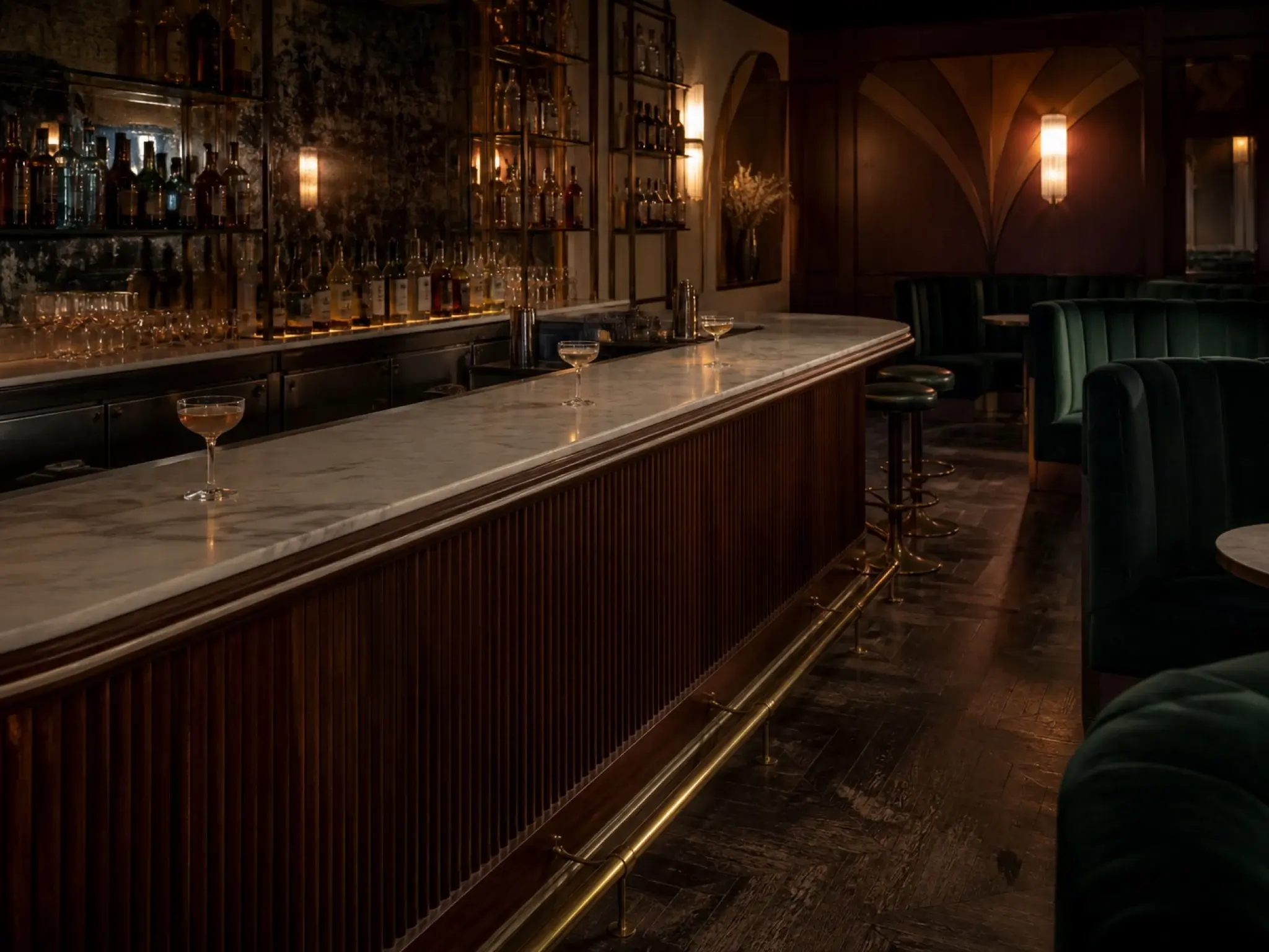 Art deco supper club interior with fluted bar joinery, velvet booths and brass detailing
