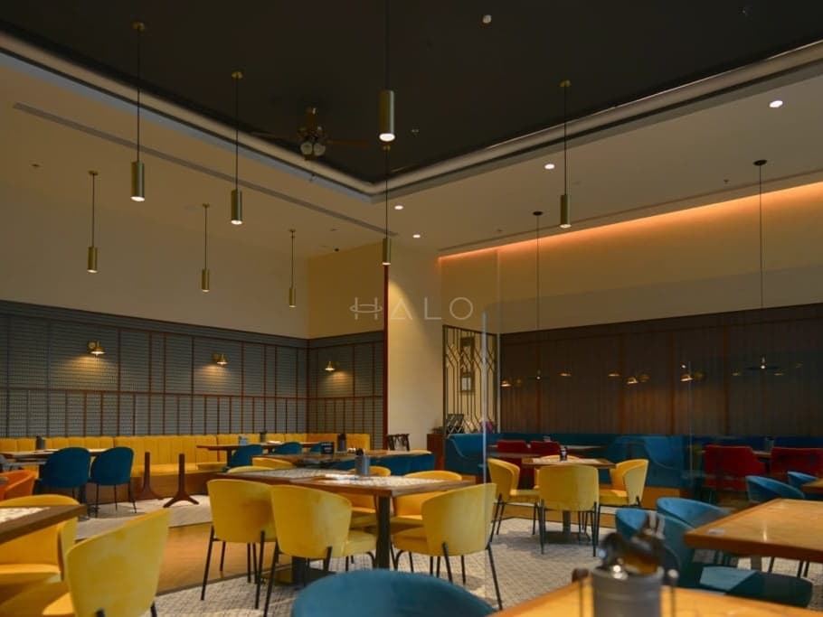 Completed hospitality interior showing finishes, lighting and seating — portfolio view 09