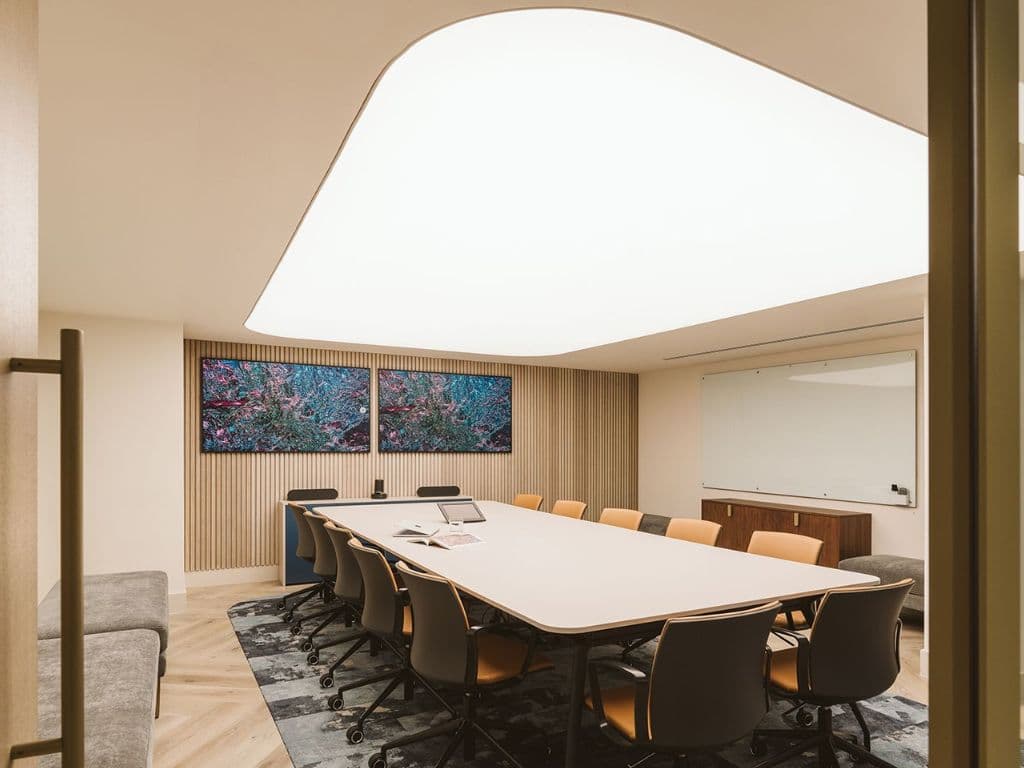 Softly squared translucent stretch ceiling lighting a meeting room in a Dubai commercial fit-out