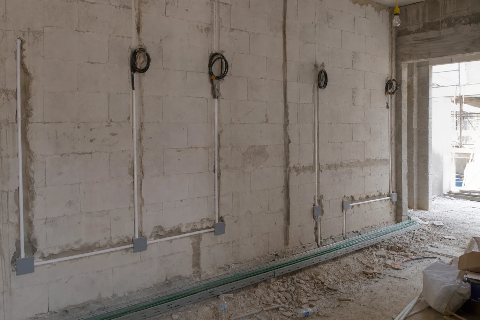 Electrical first fix with conduit and back boxes chased into blockwork