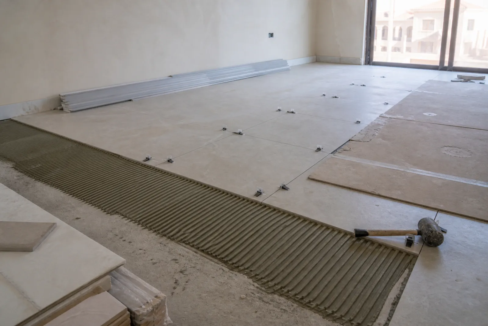 Large-format flooring laid with levelling clips over a prepared screed