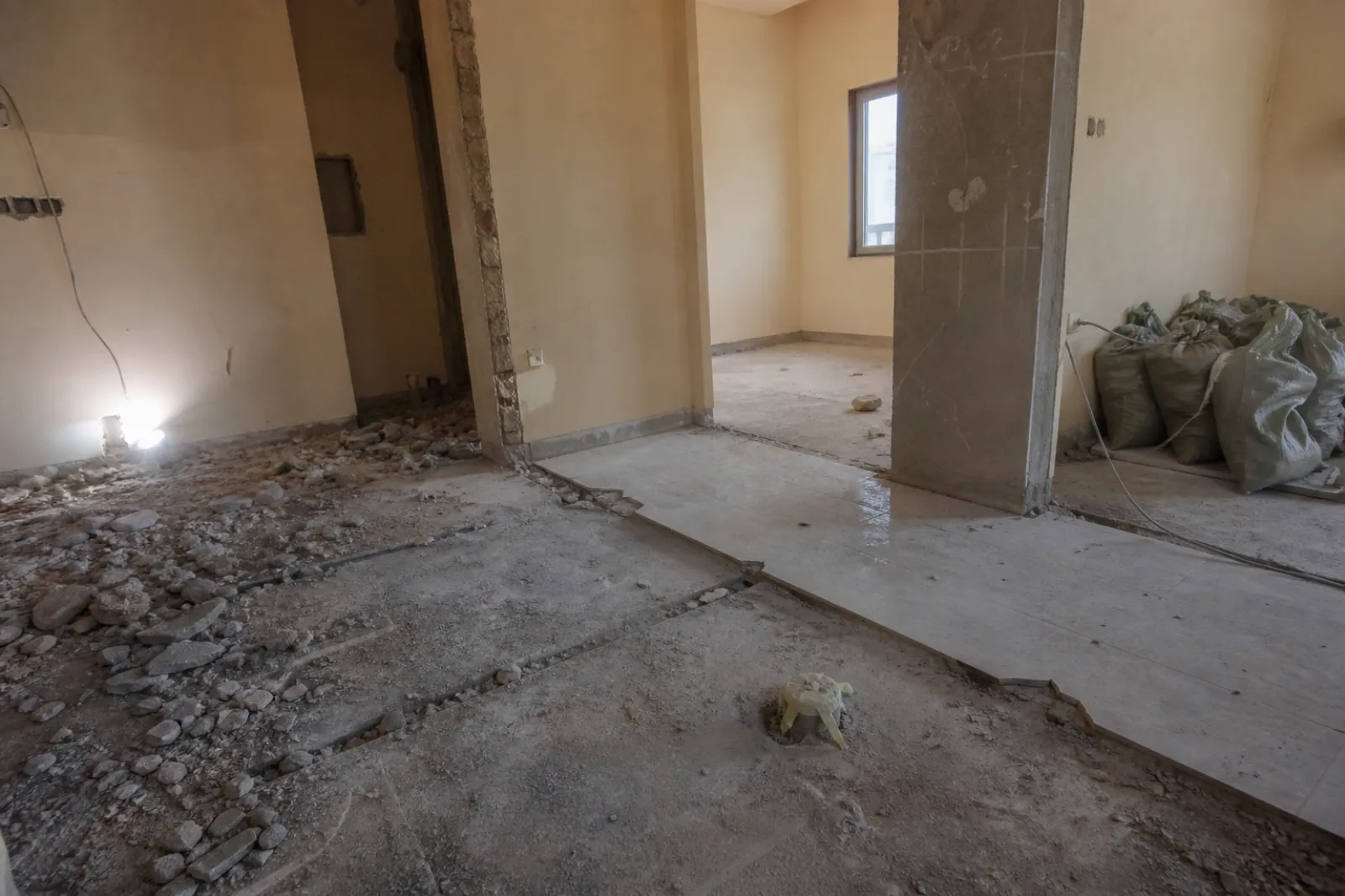 Bathroom stripped back to screed with the existing drain capped